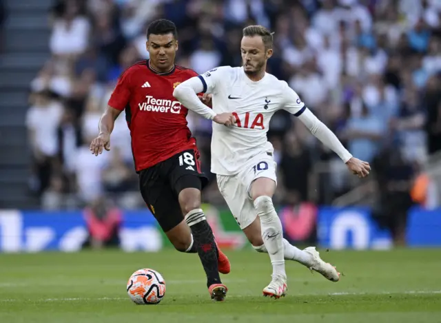 James Maddison runs past Casemiro in midfield.