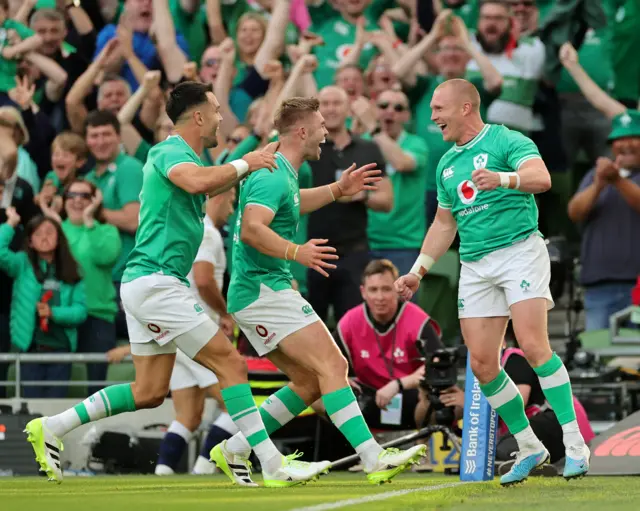 Ireland's Keith Earls celebrates with team mates Conor Murray (L) and Jack Crowley