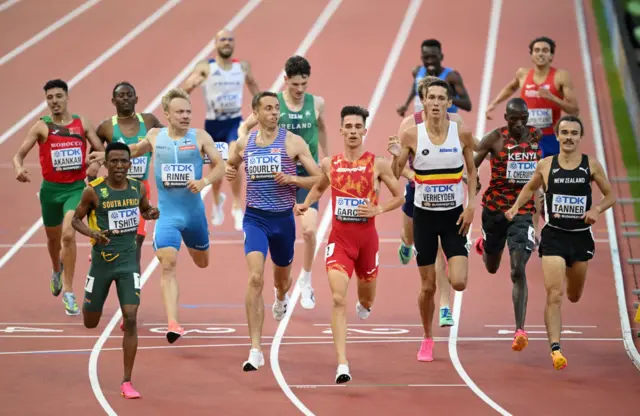 Neil Gourley, in the centre of the picture, crosses the line