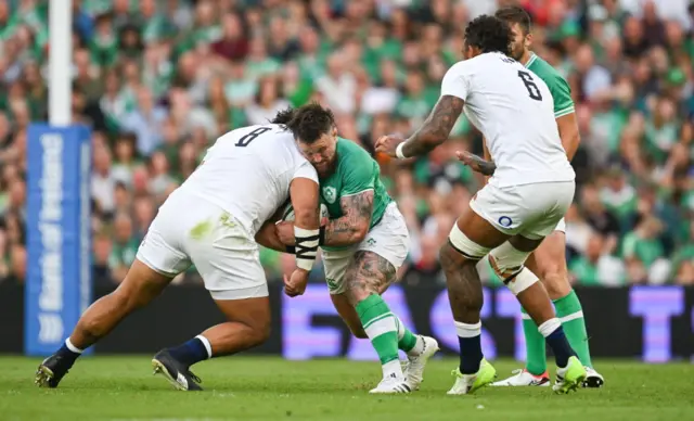 Billy Vunipola clashes with Ireland's Andrew Porter