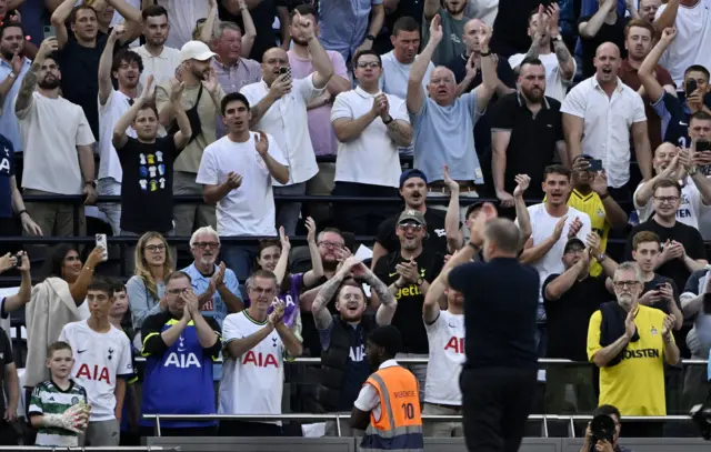 Ange Postecoglou applauds the spurs fans at full time.