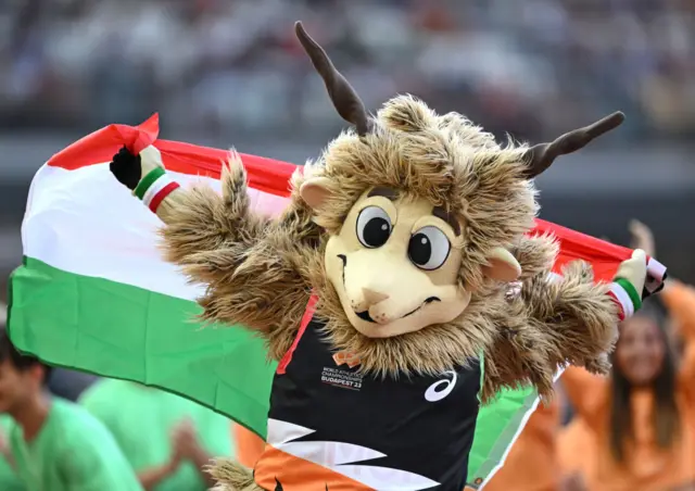 Youhuu, the mascot of the Budapest 2023 World Athletics Championships, runs on the track during the opening ceremony