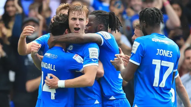 Peterborough players celebrate a goal