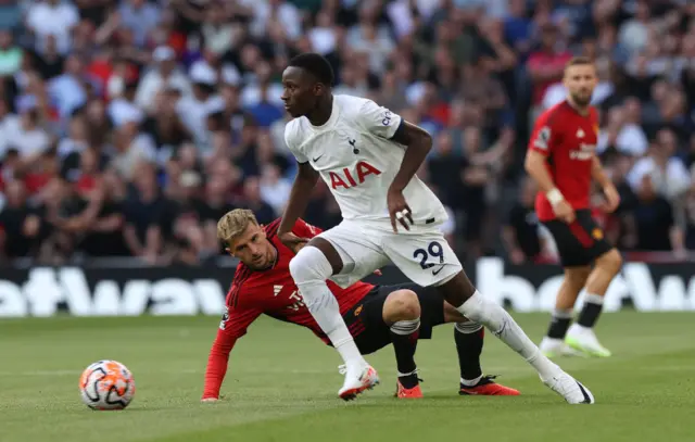 Pape Sarr dribbles past mount.