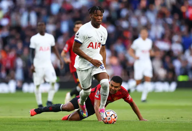 Udogie leaves Casemiro in his wake as he breaks downfield.