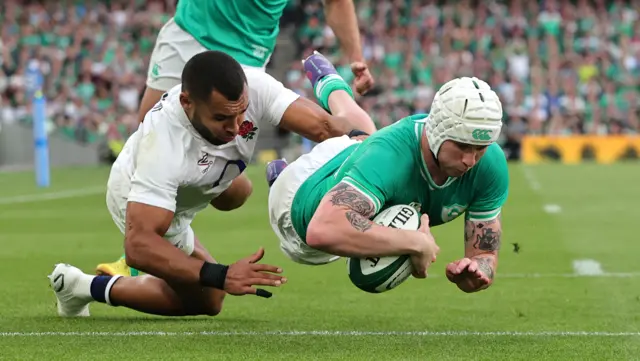 Mack Hansen of Ireland dives over to score their fourth try