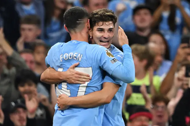 Julian Alvarez celebrates with Phil Foden