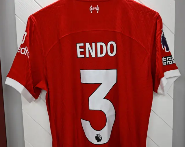 Endo's shirt hangs ready in the dressing room.