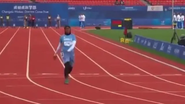 Nasra Abubakar Ali at the end of a 100m race at a university games competition in the city of Chengdu in China