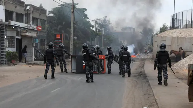 Gendarmes remove a kiosk overturned by protesters to block the road at Yarakh after opposition leader Ousmane Sonko was detained, in Dakar, Senegal 31 July 2023.