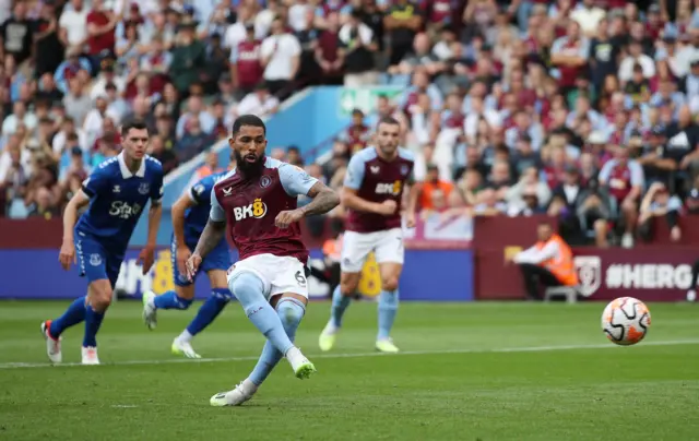 Douglas Luiz scores from the penalty spot