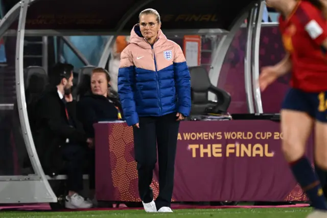 Sarina Wiegman looks on from the touchline.