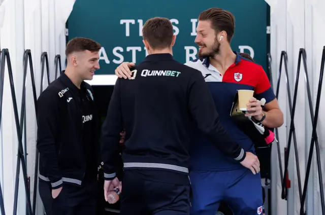 Hibernian's Josh Campbell and Will Fish with Raith Rovers' Kevin Dabrowski