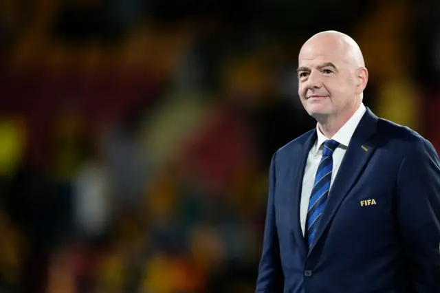 Gianni Infantino stands on the pitch at the 3rd placed play off.