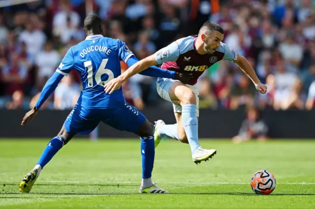 John McGinn skips past Abdoulaye Doucoure