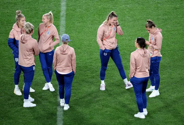 England players survey the pitch before the game.