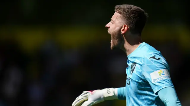 Norwich keeper Angus Gunn shouts at his team-mates