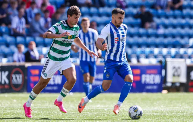 Celtic's Matt O'Riley and Kilmarnock's Daniel Armstrong in action
