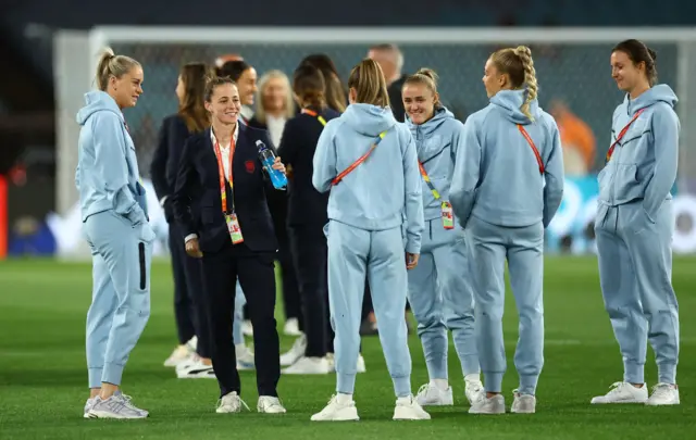 Ona Batlle stands and chats with former WSL colleagues before the game.