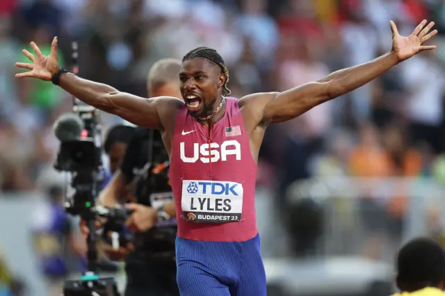 Noah Lyles celebrates