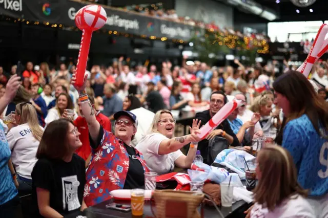 England fans cheer as they wait for the start of a live broadcast of the Women's World Cup final football match between Spain and England,