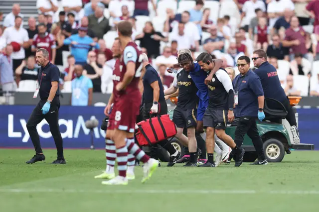 Carney Chukwuemeka is helped off the pitch