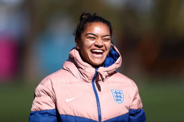 Jess Carter smiles at training