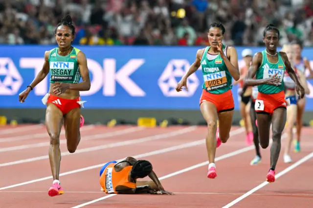 Sifan Hassan of the Netherlands falls in the 10,000m race at World Athletics Championships Budapest 2023 at the National Athletics Centre on in Budapest, Hungary - 19 August 2023