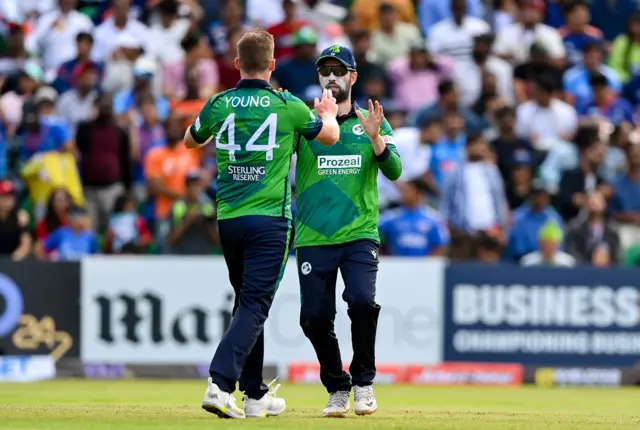 Craig Young of Ireland is congratulated by teammate Andrew Balbirnie