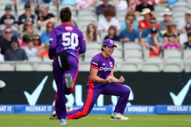 Alice Davidson-Richards celebrates taking a catch