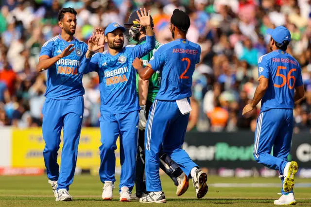 Mukesh Kumar and Arshdeep Singh celebrate after bowling out Paul Stirling