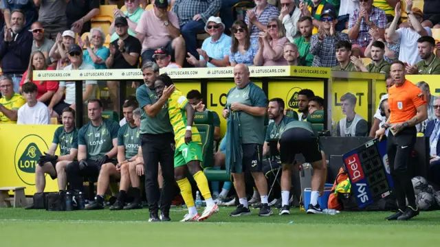 David Wagner embraces Jonathan Rowe after he is substituted