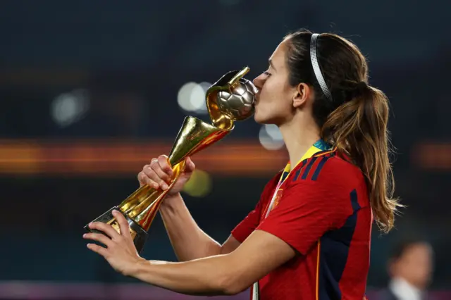 Bonmati kisses the trophy.