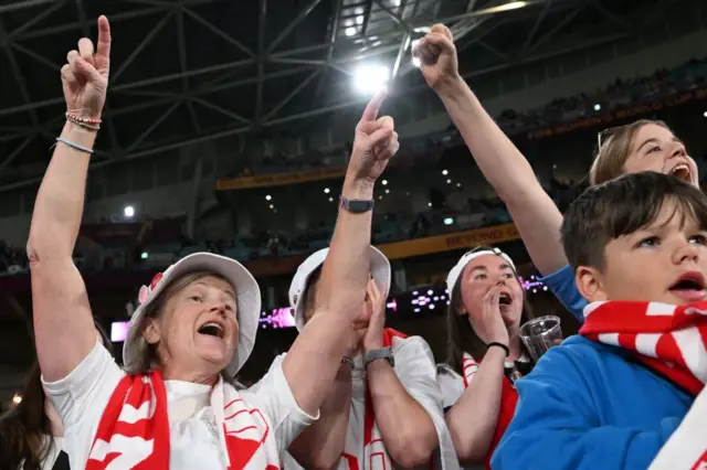 England fans cheer on the side as they emerge onto the pitch.