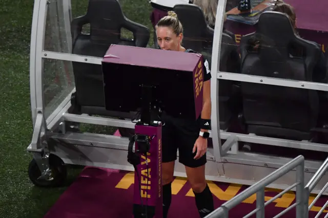 Ref Tori Penso looks at the VAR monitor.