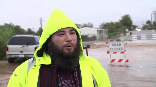 Juan Fejfar speaks to reporters after evacuating from their home in san bernadinho county