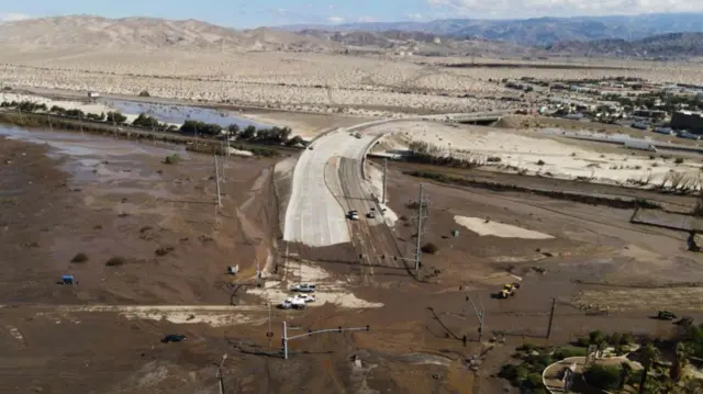 Wide view of Interstate 10 highway covered in mud in Rancho Mirage, California