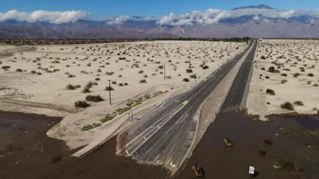 Wide view of Interstate 10 highway covered in mud in Rancho Mirage, California