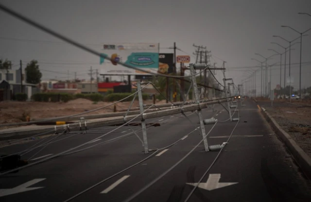 Power towers were collapsed when Storm Hilary made landfall in Baja California state, in Mexicali, Mexico