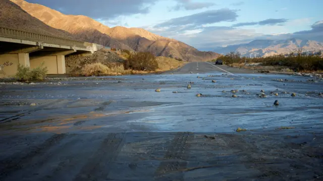 State Highway 101, a highway leading in and out of Palm Springs, remains covered with moving water the morning after Tropical Storm Hilary passed.