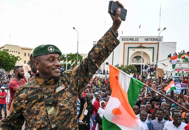 Niger's Army sergeant and artist Maman Sani Maigochi performs as supporters of Niger's National Concil of Sefeguard of the Homeland (CNSP) gather at Place de la Concertation in Niamey on August 20, 2023.