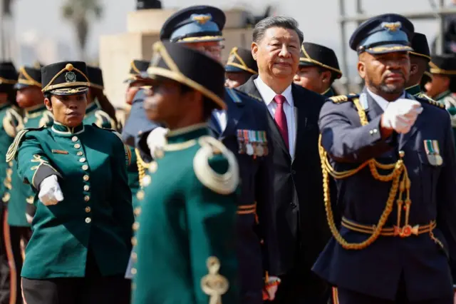 Chinese President Xi Jinping is welcomed by South African ceremonial marches.