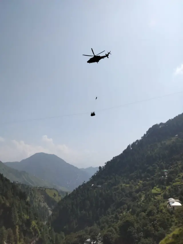 Helicopter arrives at standard cable car