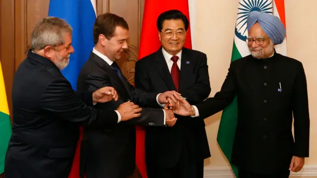 The four leaders join hands