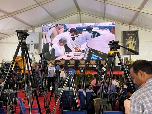 Journalists set up cameras at the media centre at Isro headquarters