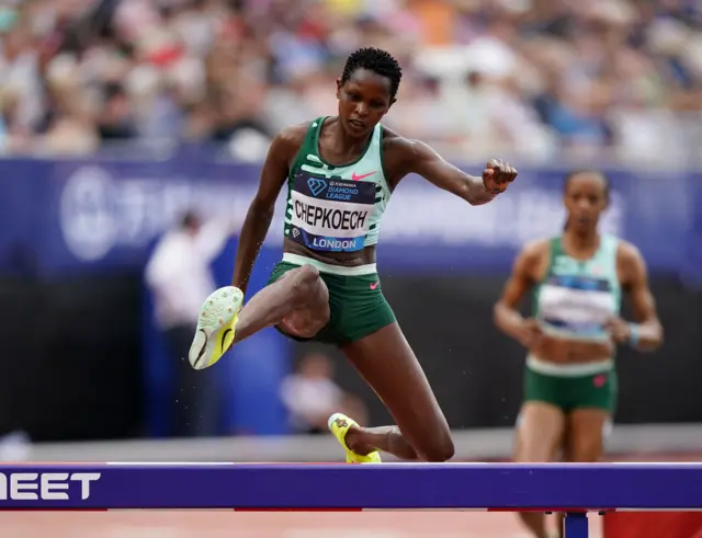 Jackline Chepkoech jumps over a hurdle during the women's 3,000m steeplechase event at the London Diamond League.