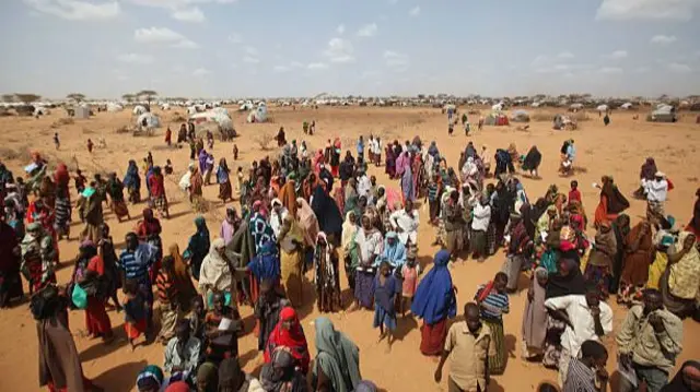 Newly arrived Somalian refugees queue for tents being distributed by the Lutheran World Federation charity on the edge of the Dagahaley refugee camp which makes up part of the giant Dadaab refugee settlement