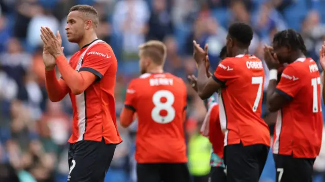 Luton Town players after their loss to Brighton