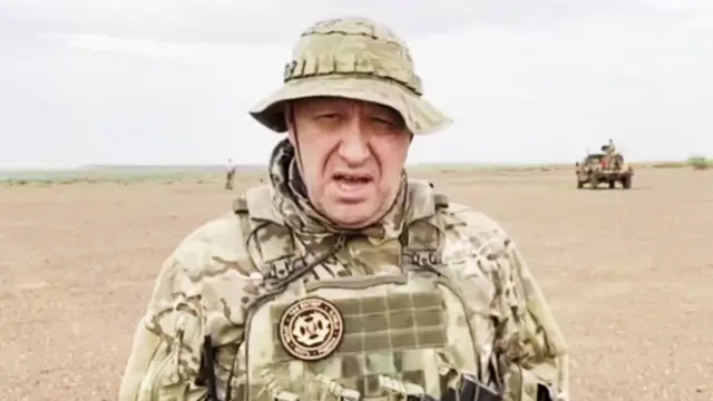 Yevgeny Prigozhin in what appears to be a desert environment