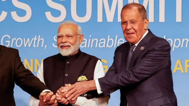 Modi and Lavrov hold hands